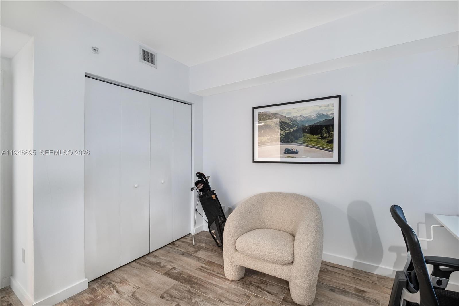 650 Northeast 32nd Street, Unit 4306 Miami, FL 33137 - Photo 24 of 52 a workspace with furniture and wooden floor