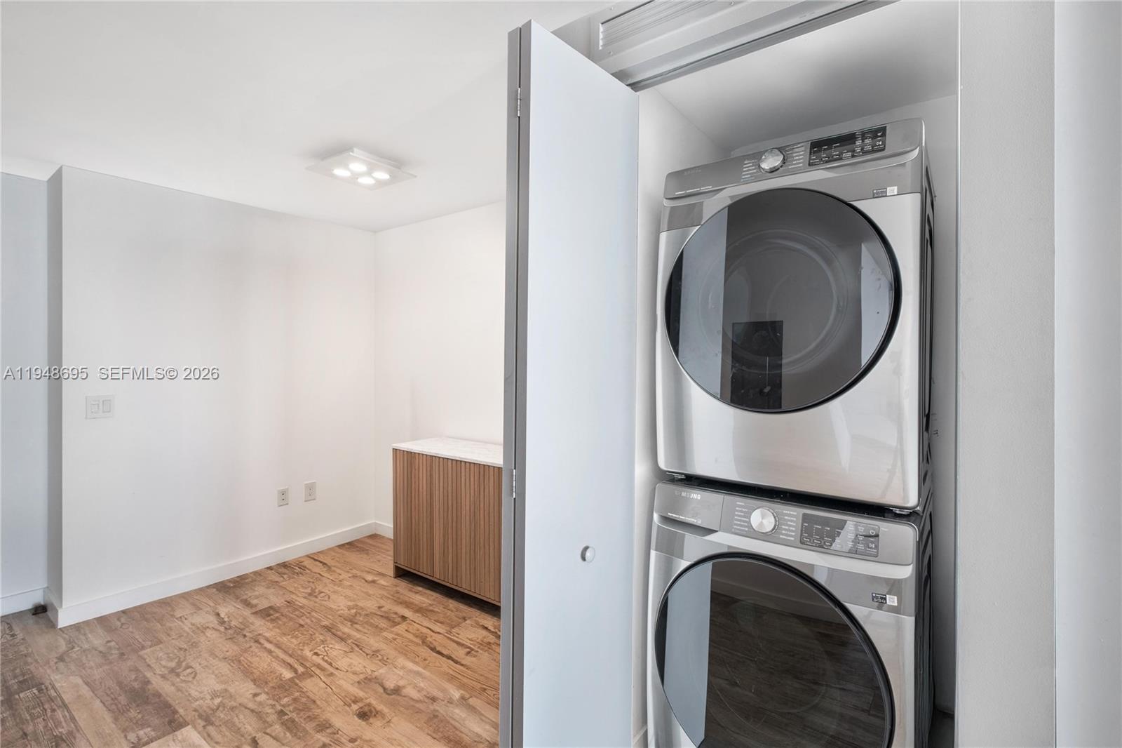 650 Northeast 32nd Street, Unit 4306 Miami, FL 33137 - Photo 27 of 52 a view of a hallway with washer and dryer