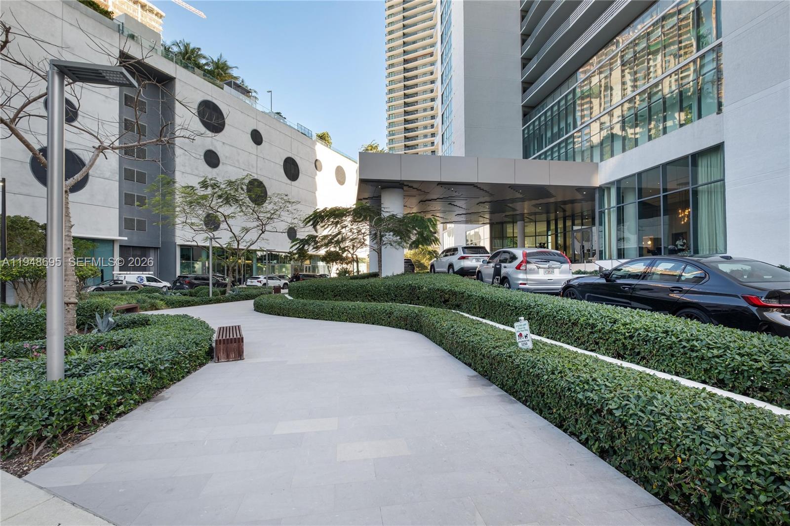 650 Northeast 32nd Street, Unit 4306 Miami, FL 33137 - Photo 29 of 52 a view of a building with a yard and plants