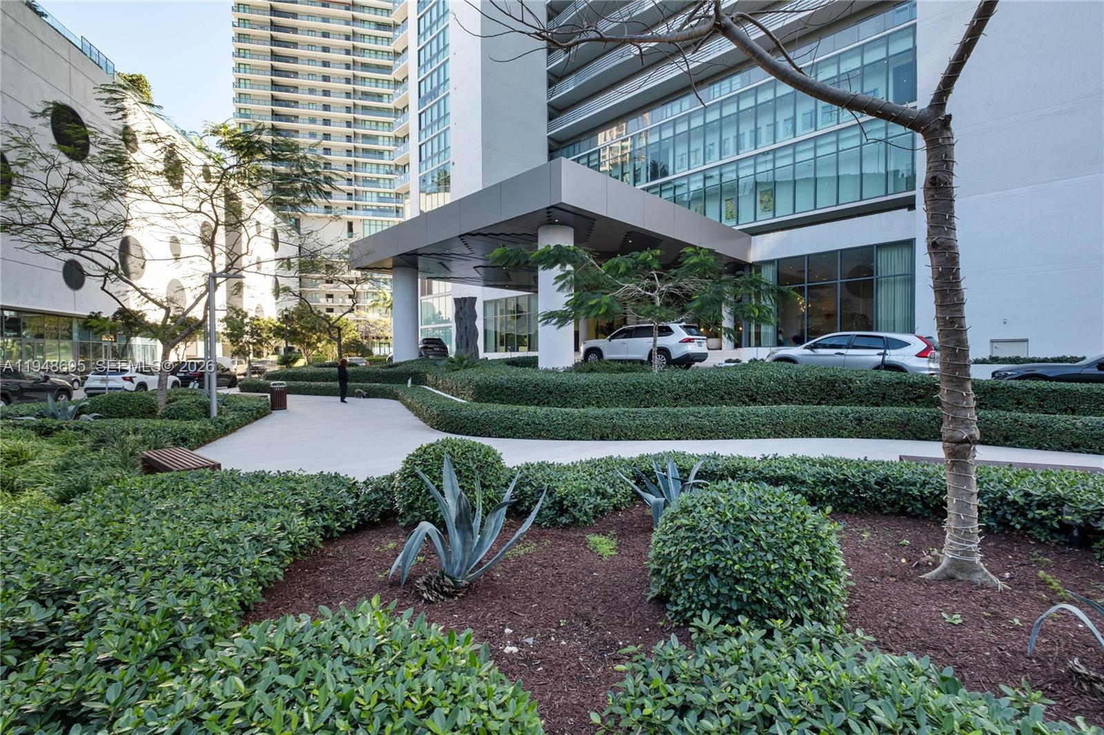650 Northeast 32nd Street, Unit 4306 Miami, FL 33137 - Photo 30 of 52 front view of a house with a yard