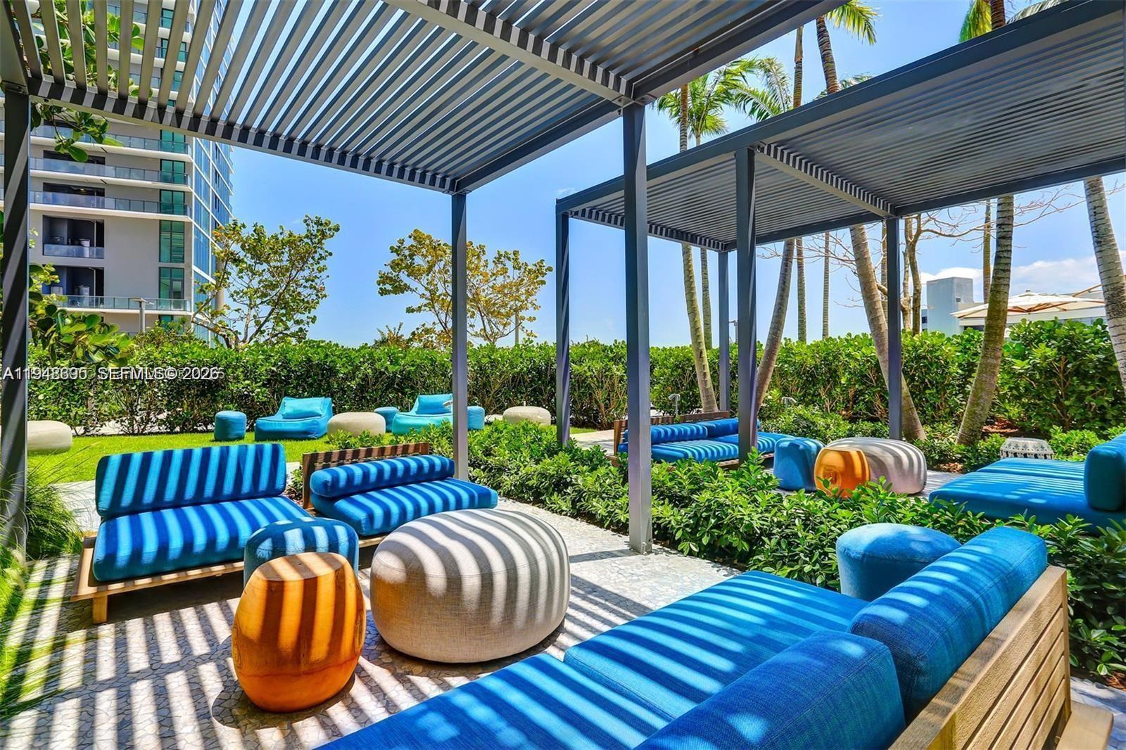 650 Northeast 32nd Street, Unit 4306 Miami, FL 33137 - Photo 38 of 52 a view of an outdoor sitting area with furniture and garden view