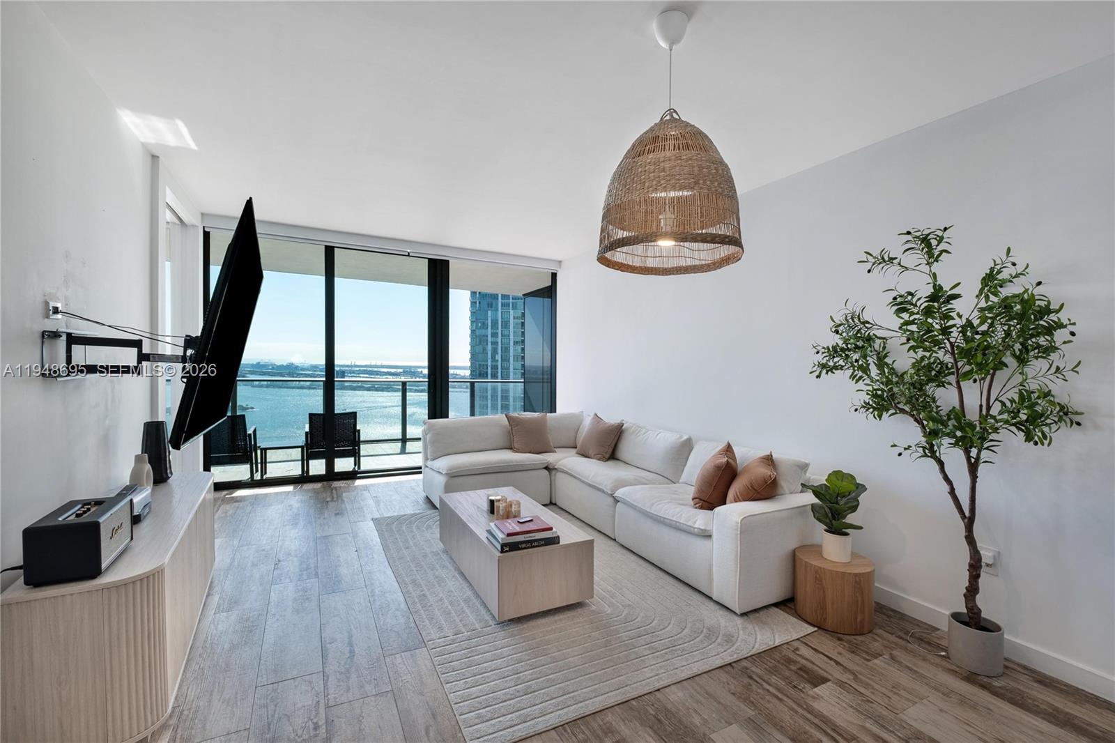 650 Northeast 32nd Street, Unit 4306 Miami, FL 33137 - Photo 4 of 52 a living room with furniture and a large window