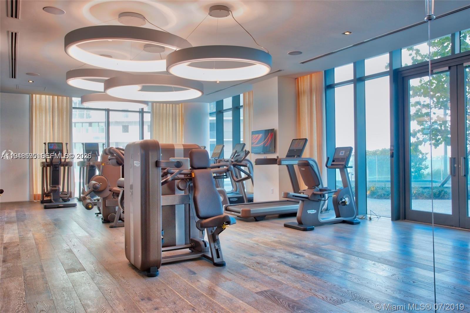 650 Northeast 32nd Street, Unit 4306 Miami, FL 33137 - Photo 41 of 52 a view of a room with gym equipment