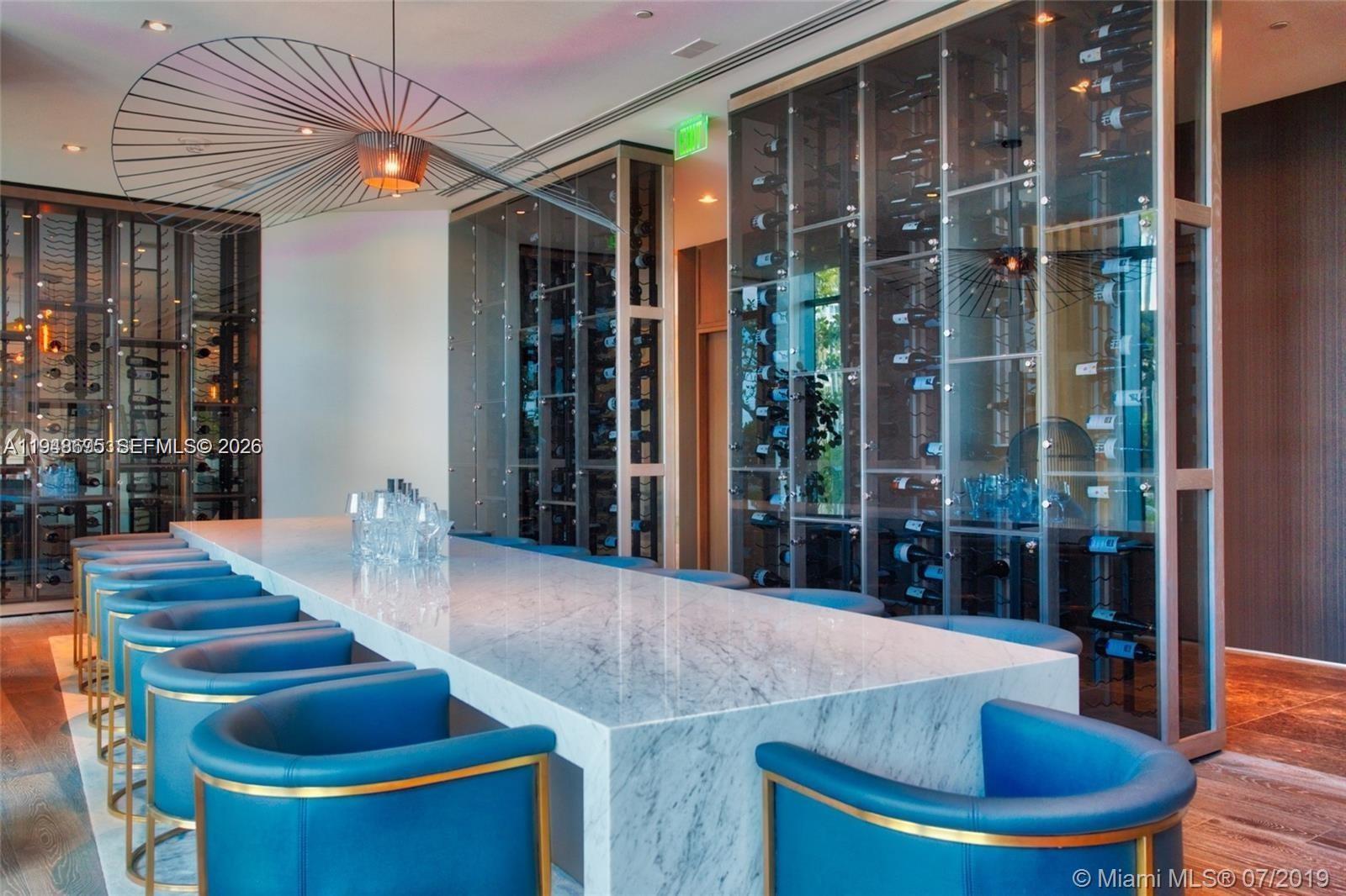 650 Northeast 32nd Street, Unit 4306 Miami, FL 33137 - Photo 49 of 52 a view of a dining room with furniture window and wooden floor