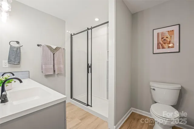 a bathroom with a glass door shower