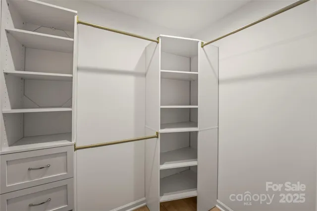 a bedroom with bed and a window