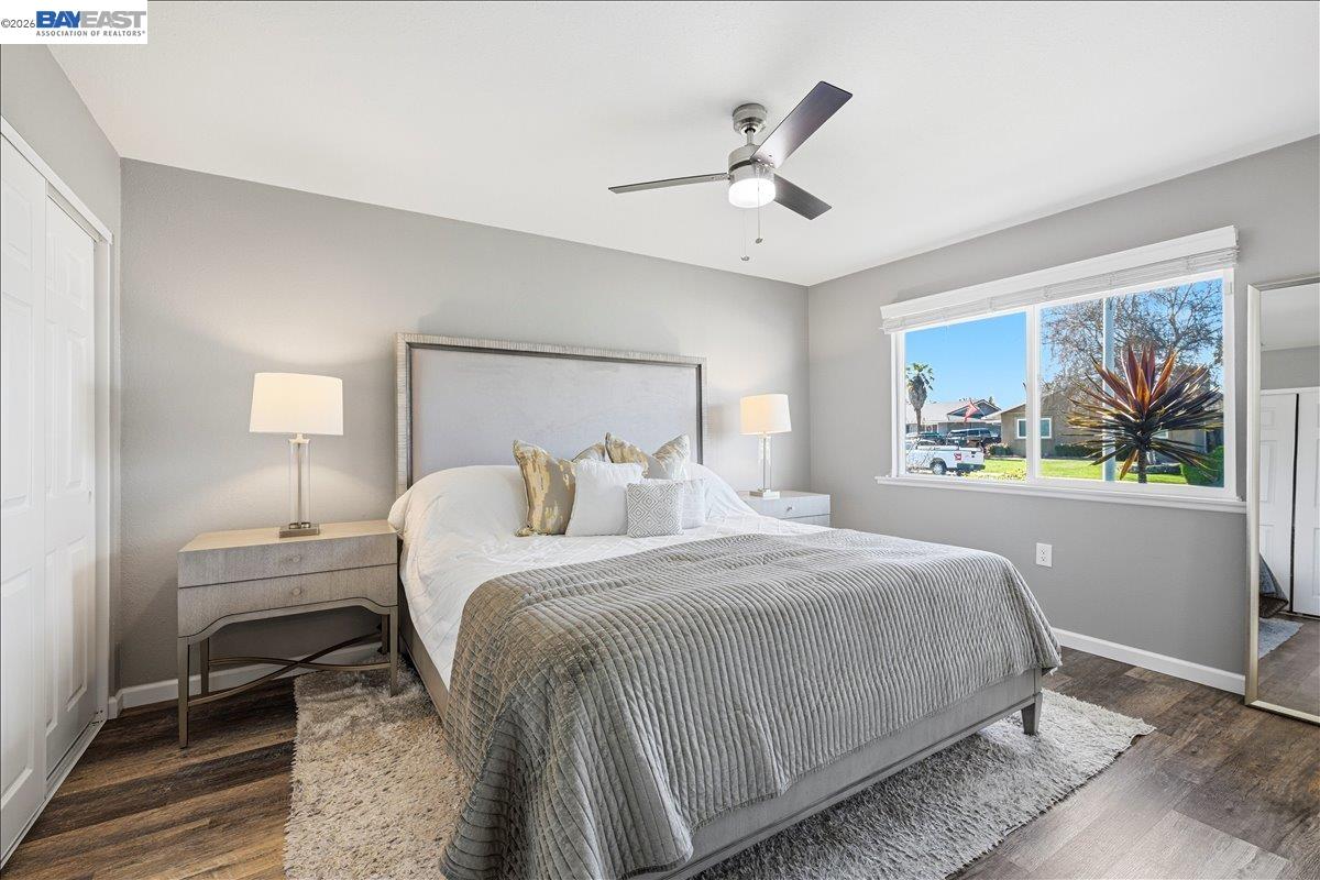 1279 Marigold Road Livermore, CA 94551 - Photo 14 of 53 a bedroom with a bed and a painting on the wall