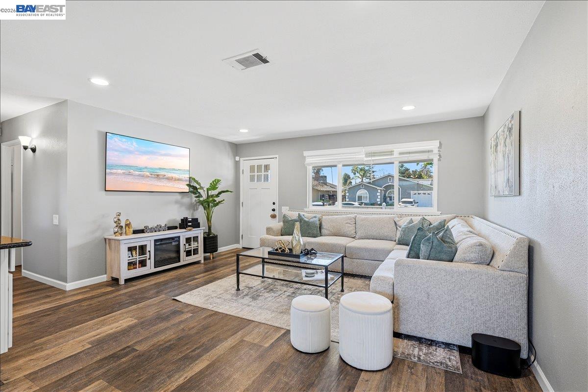 1279 Marigold Road Livermore, CA 94551 - Photo 15 of 53 a living room with furniture and a flat screen tv