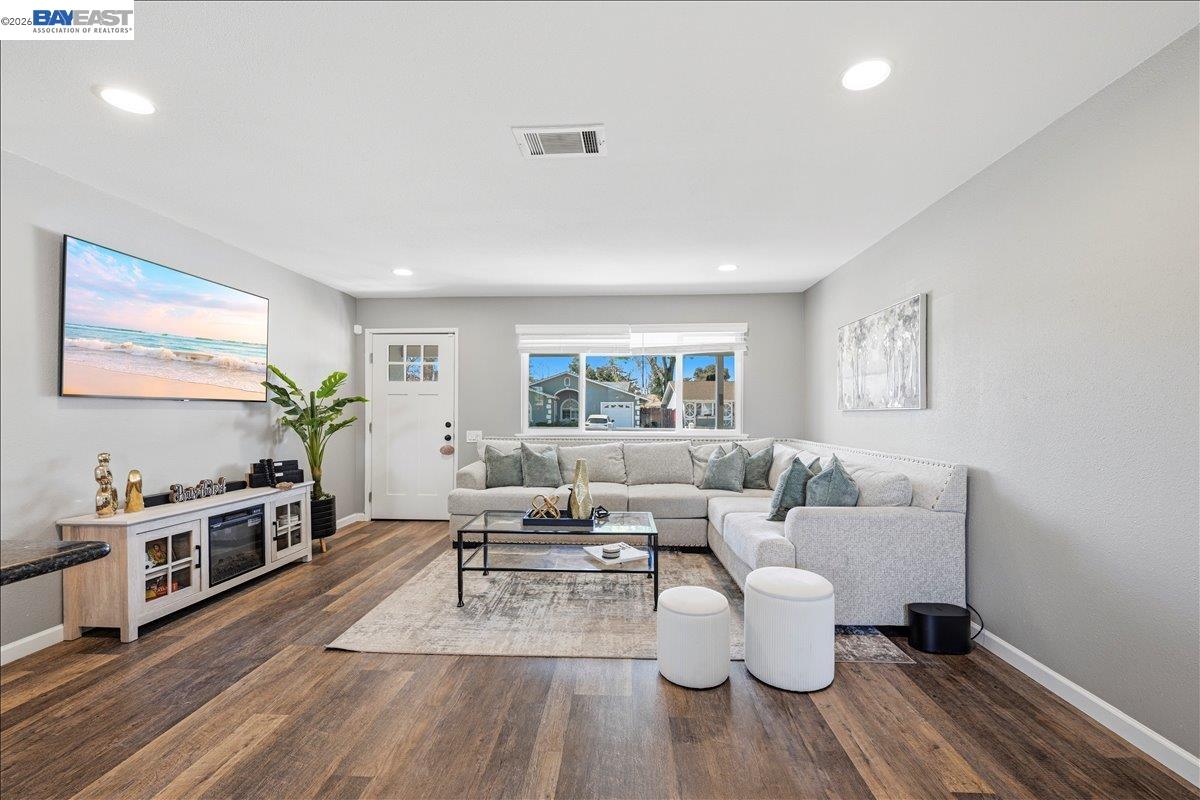 1279 Marigold Road Livermore, CA 94551 - Photo 17 of 53 a living room with furniture and wooden floor