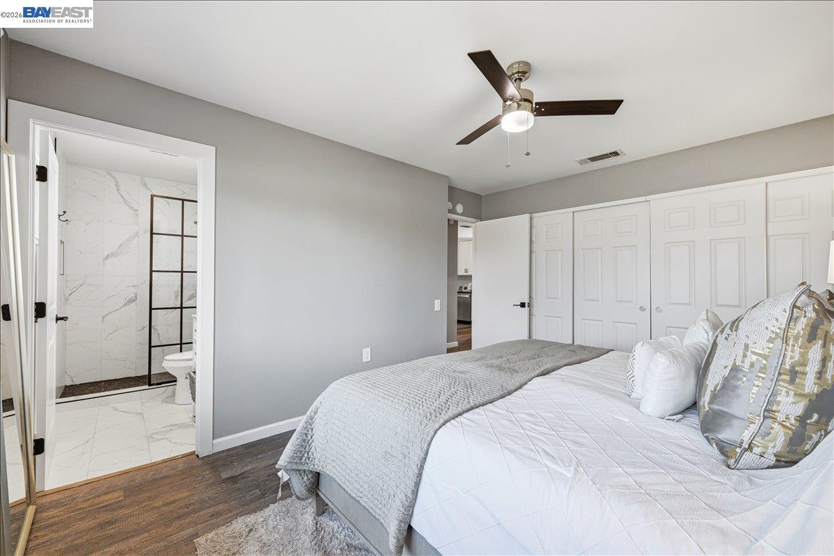 1279 Marigold Road Livermore, CA 94551 - Photo 21 of 53 a bedroom with a large bed and a ceiling fan