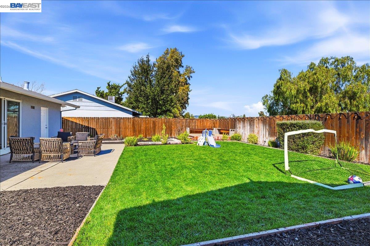 1279 Marigold Road Livermore, CA 94551 - Photo 30 of 53 a view of a house with backyard and a tree