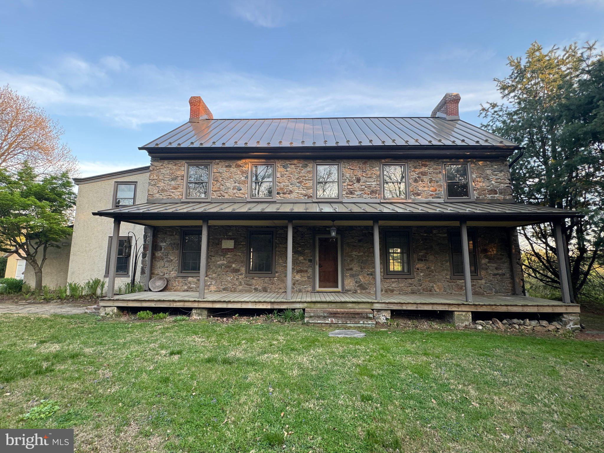 702 Lenape Road West Chester, PA 19382 - Photo 2 of 12 Charming stone farmhouse with porch.