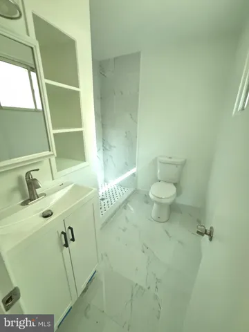 a bathroom with a sink and toilet