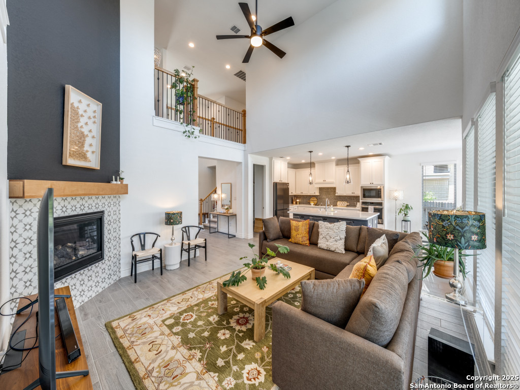 25902 Madison Ranch San Antonio, TX 78255 - Photo 11 of 36 a living room with furniture and a fireplace