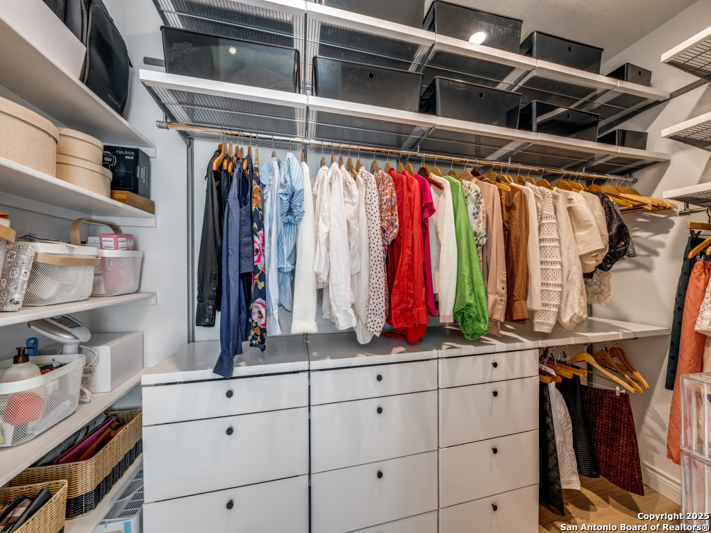 25902 Madison Ranch San Antonio, TX 78255 - Photo 21 of 36 a view of walk in closet with clothes and shoes
