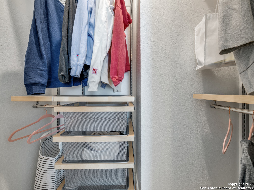 25902 Madison Ranch San Antonio, TX 78255 - Photo 25 of 36 a view of towel hanging in closet