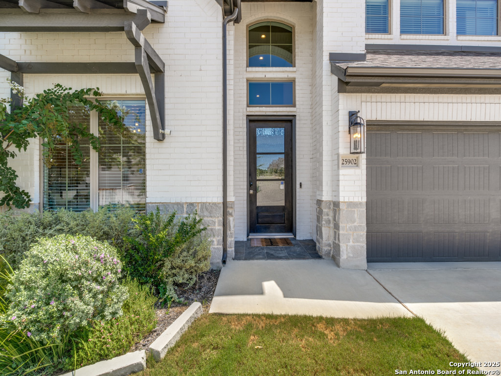 25902 Madison Ranch San Antonio, TX 78255 - Photo 3 of 36 a view of a entryway door of the house