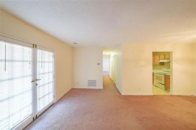 a view of empty room with a empty space