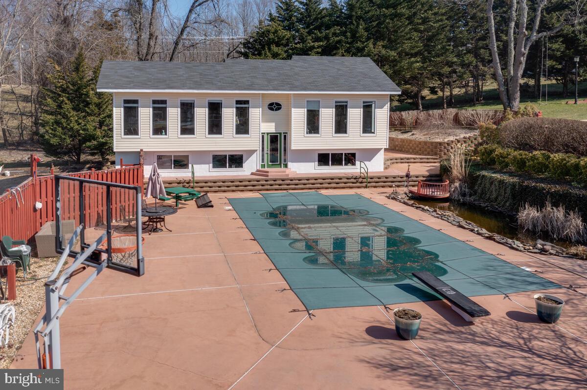 6269 Solomons Island Road Tracys Landing, MD 20779 - Photo 87 of 99 Pool house and pool