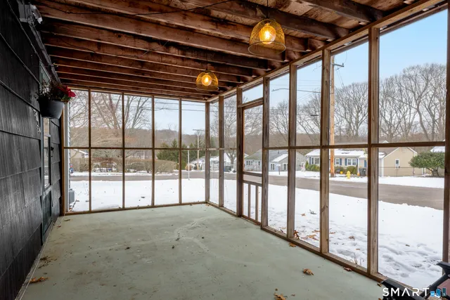 a view of room with furniture and floor to ceiling windows