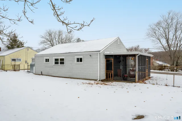 a view of dirt yard with a large tree