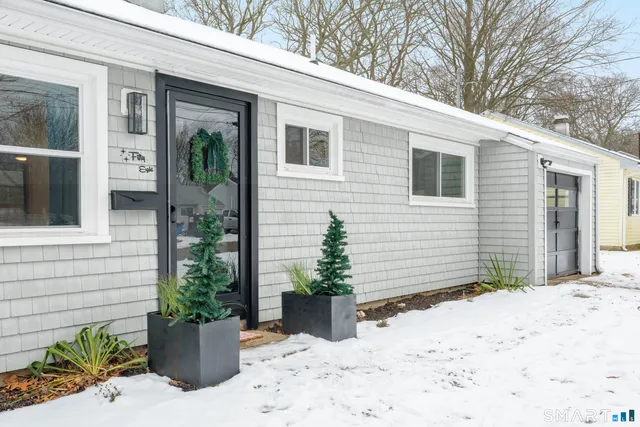 a view of a house with yard and sitting space