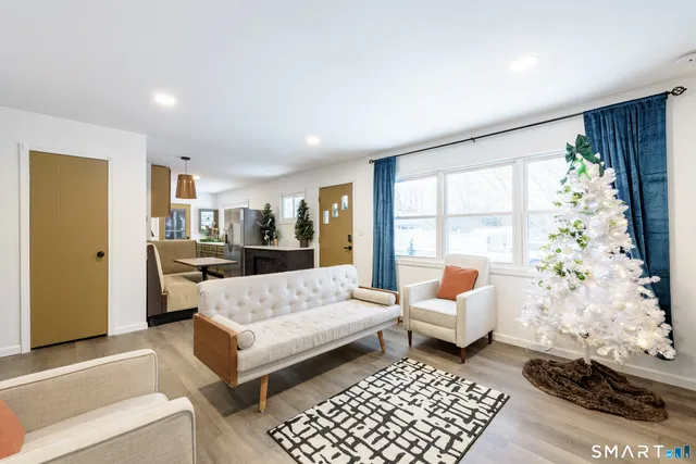 a living room with furniture and a window