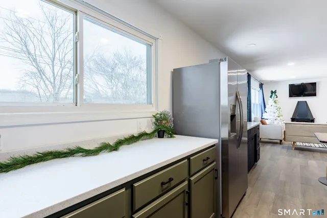 a bathroom with a sink a toilet and shower curtain