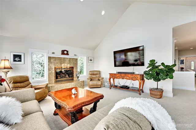 a spacious bathroom with a double vanity sink a large mirror and shower