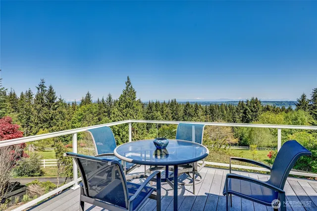 a living room with furniture and a book shelf