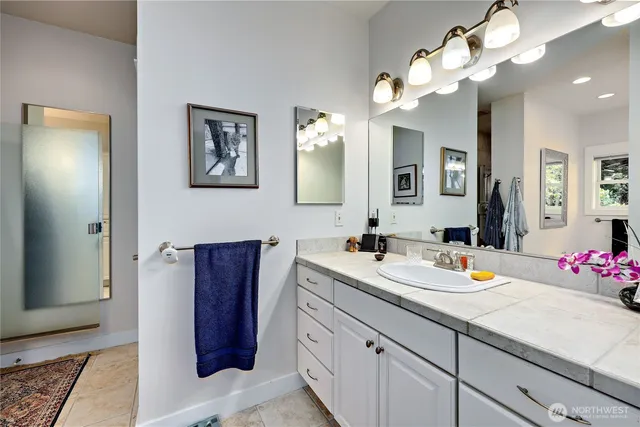 an aerial view of a house with a yard basket ball court and outdoor seating