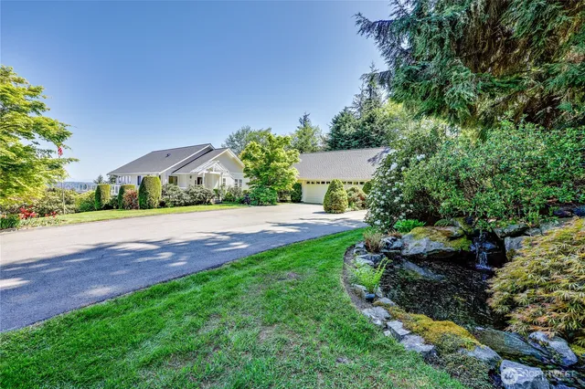 a view of a hallway with elevator and glass door