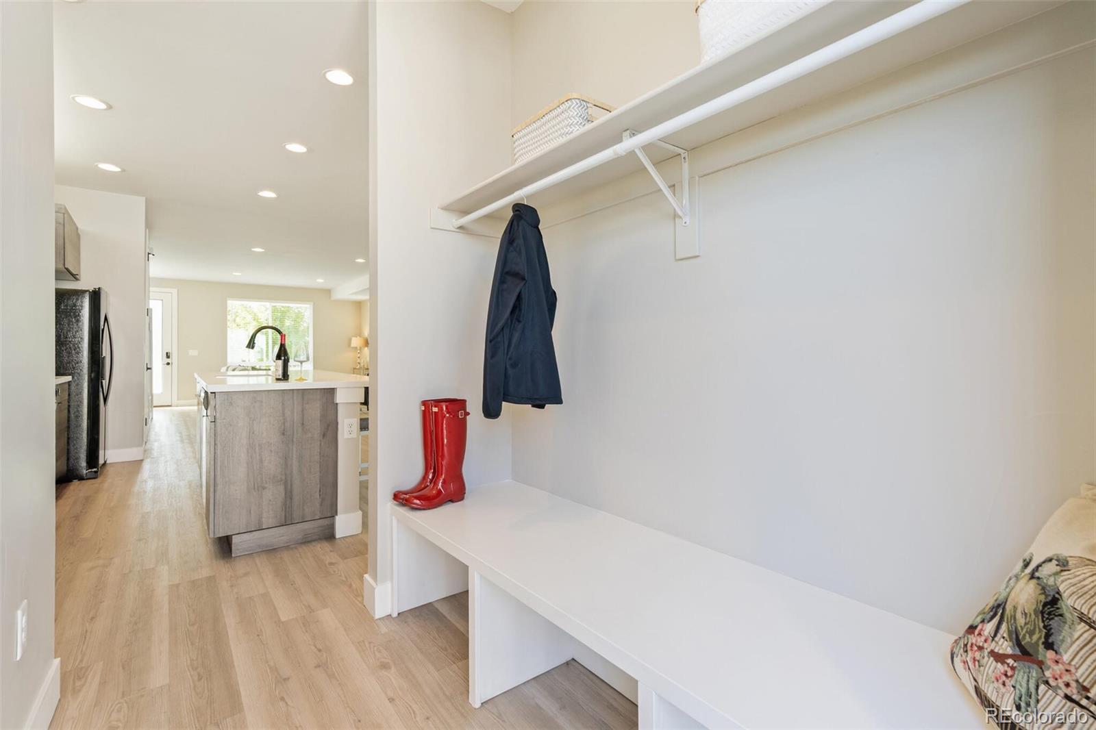 4306 Sherman Street Denver, CO 80216 - Photo 12 of 32 a hallway with table and couch