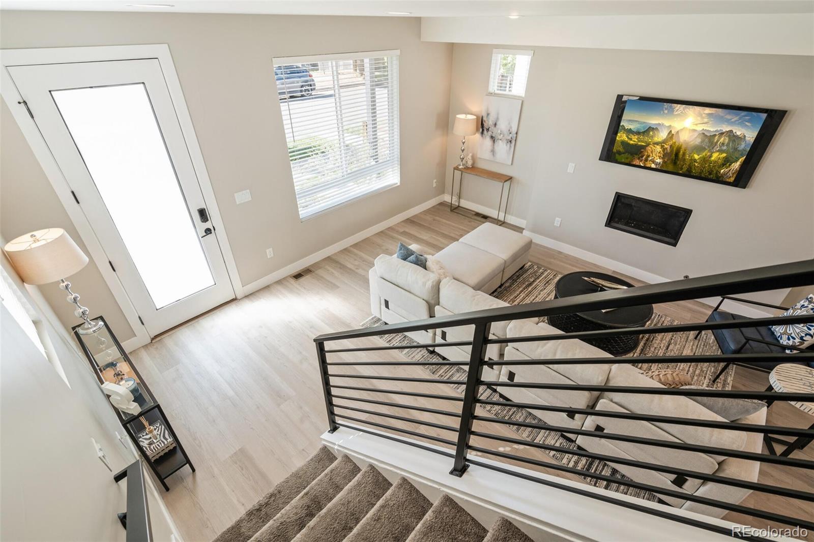 4306 Sherman Street Denver, CO 80216 - Photo 14 of 32 a view of an empty room with wooden floor