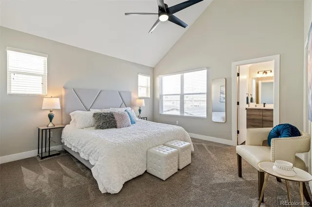 a bedroom with a bed and a couch