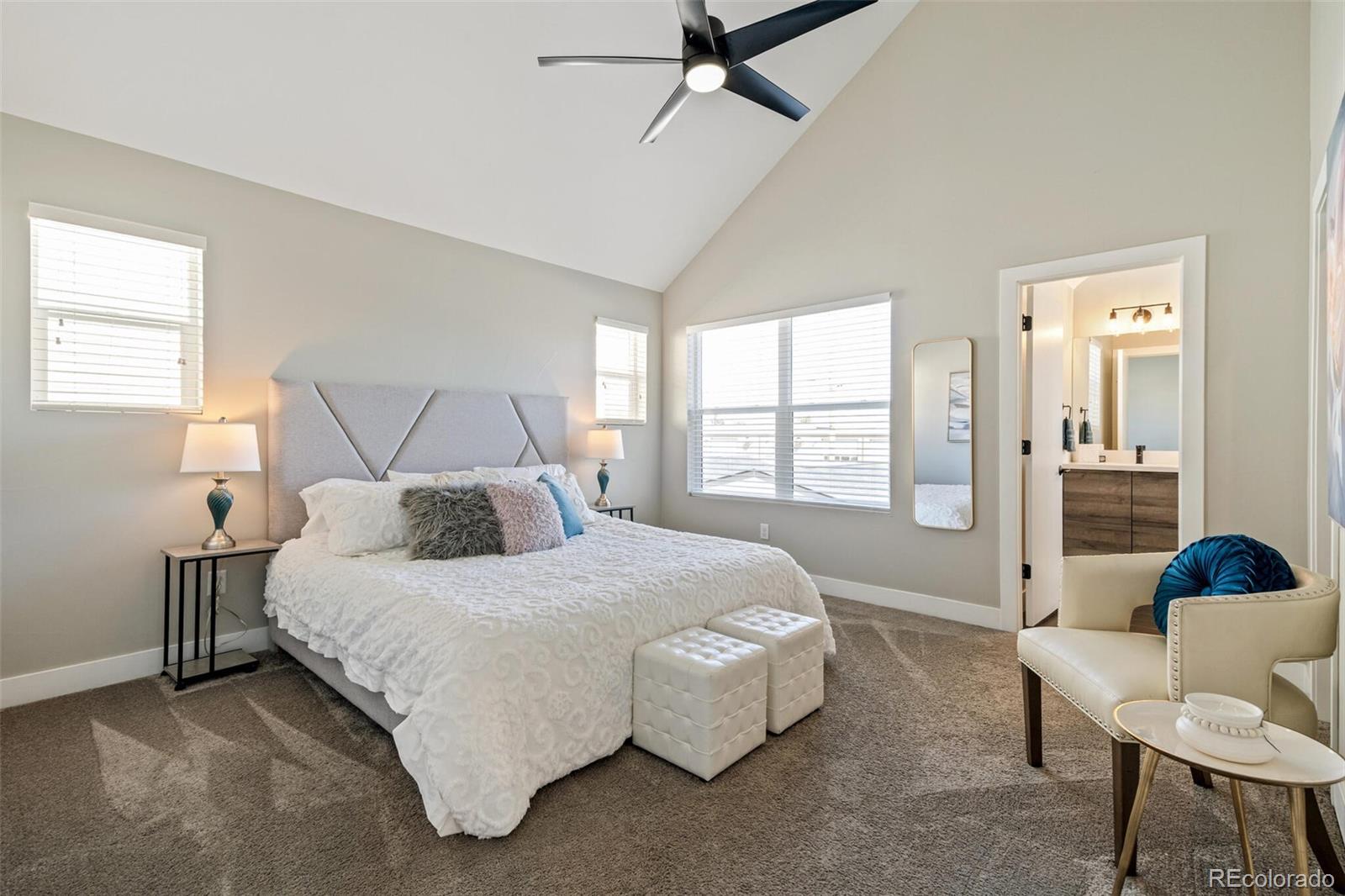 4306 Sherman Street Denver, CO 80216 - Photo 15 of 32 a bedroom with a bed and a couch