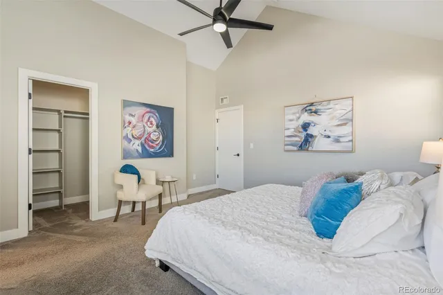 a bedroom with a bed and a desk