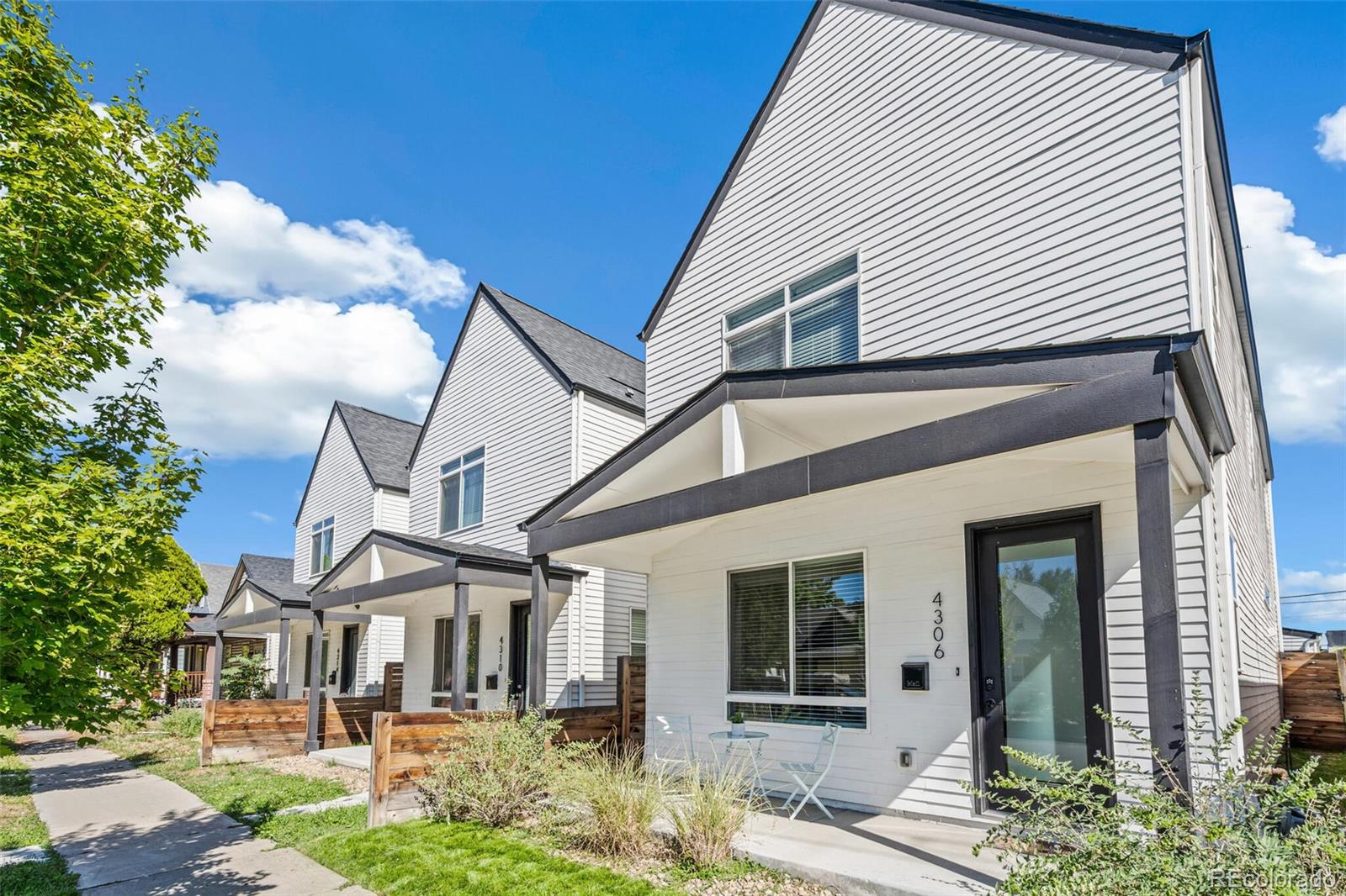 4306 Sherman Street Denver, CO 80216 - Photo 2 of 32 front view of a house with a yard