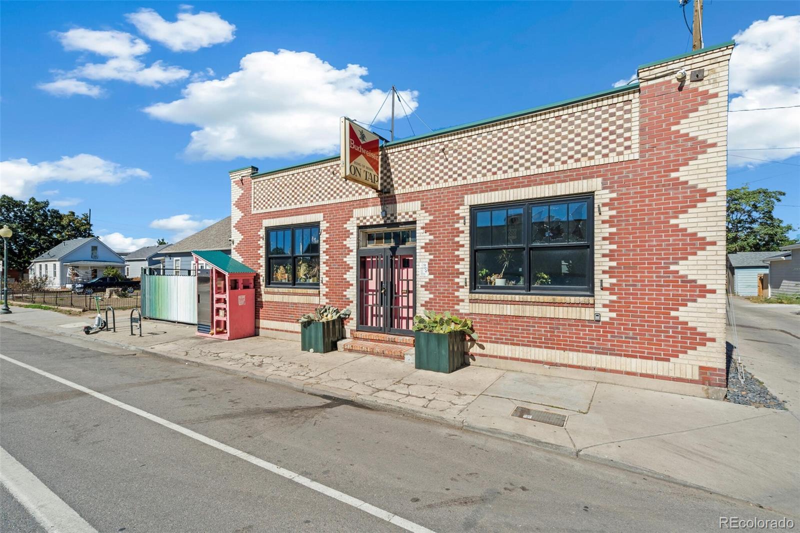 4306 Sherman Street Denver, CO 80216 - Photo 29 of 32 a front view of a building with glass windows