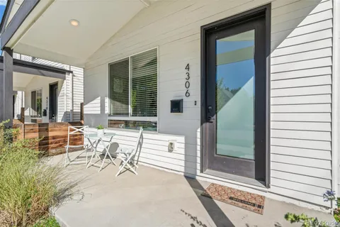 a view of a dinning room with wooden floor and furniture