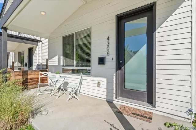 a view of a dinning room with wooden floor and furniture