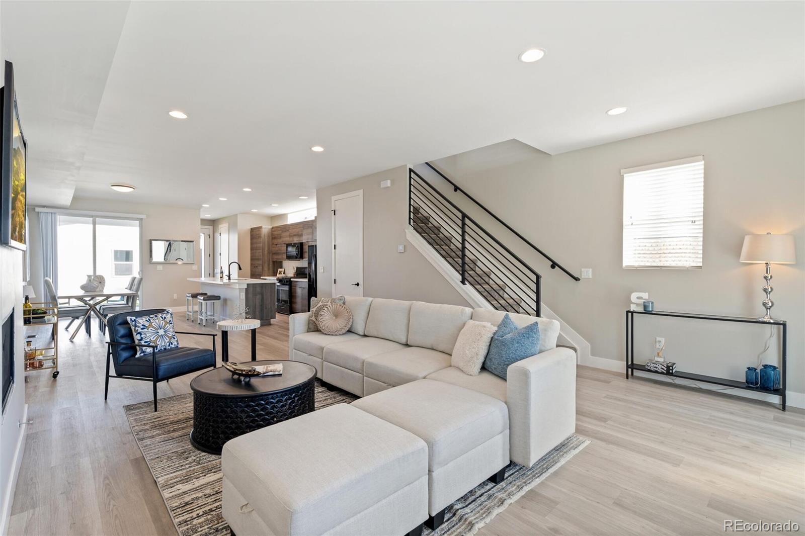 4306 Sherman Street Denver, CO 80216 - Photo 4 of 32 a living room with furniture and wooden floor
