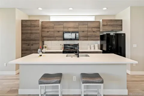 a kitchen with a sink and cabinets