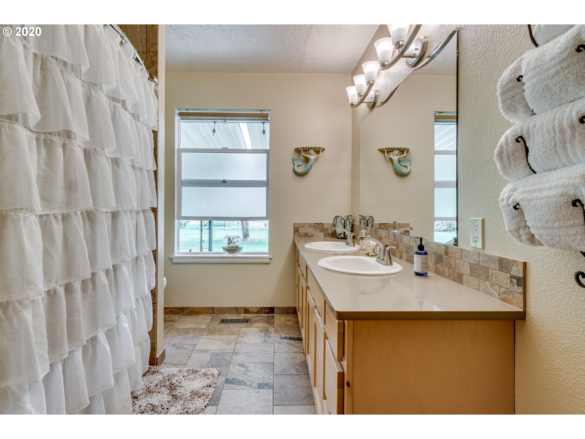 18400 Southeast Richey Road Gresham, OR 97080 - Photo 21 of 32 a bathroom with a sink vanity granite tub and shower
