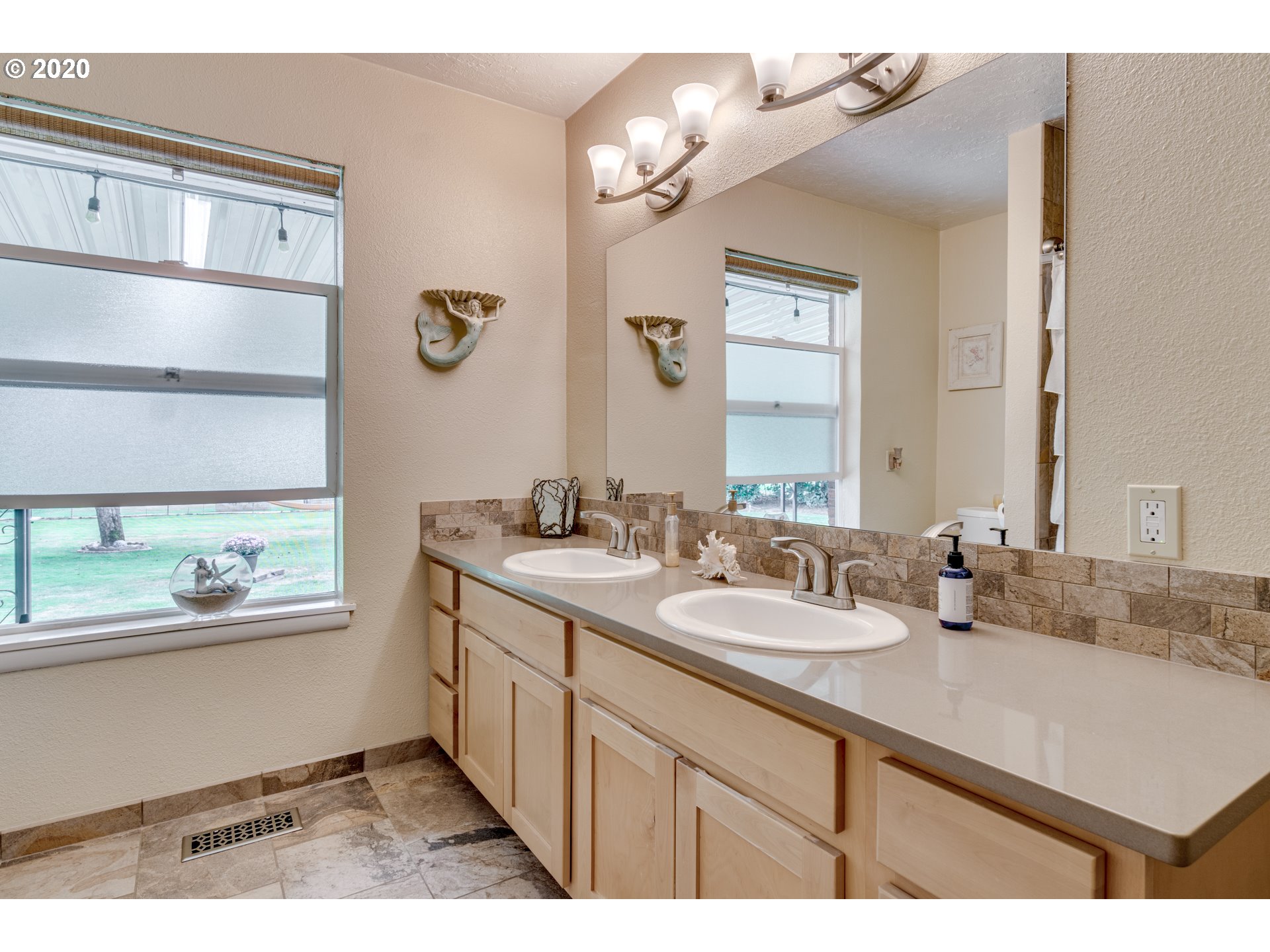 18400 Southeast Richey Road Gresham, OR 97080 - Photo 22 of 32 a bathroom with a sink double vanity and a mirror