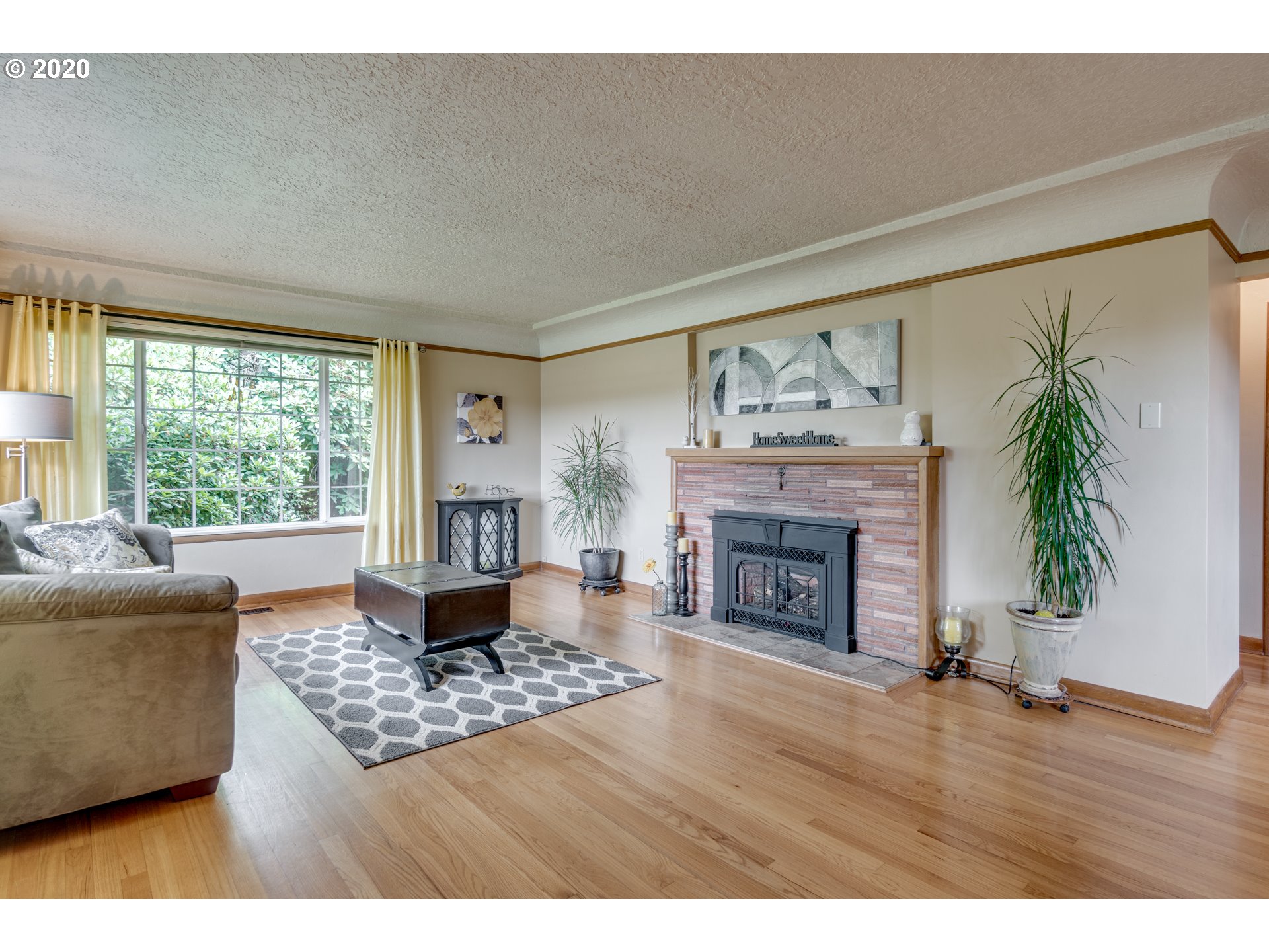 18400 Southeast Richey Road Gresham, OR 97080 - Photo 4 of 32 a living room with furniture and a fireplace