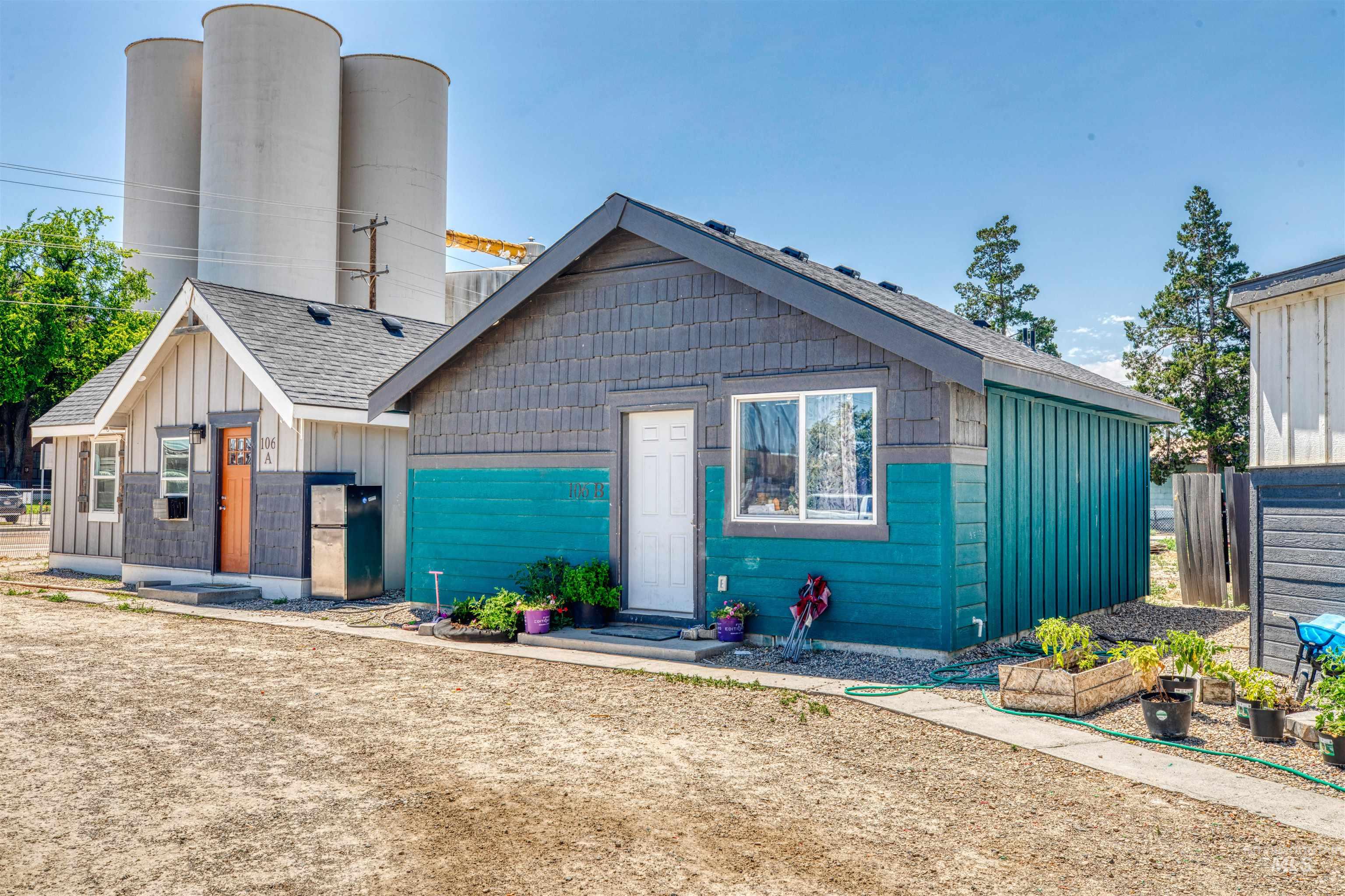 106 East Main Street Nyssa, OR 97913 - Photo 13 of 32 View of front facade featuring board and batten siding and a shingled roof