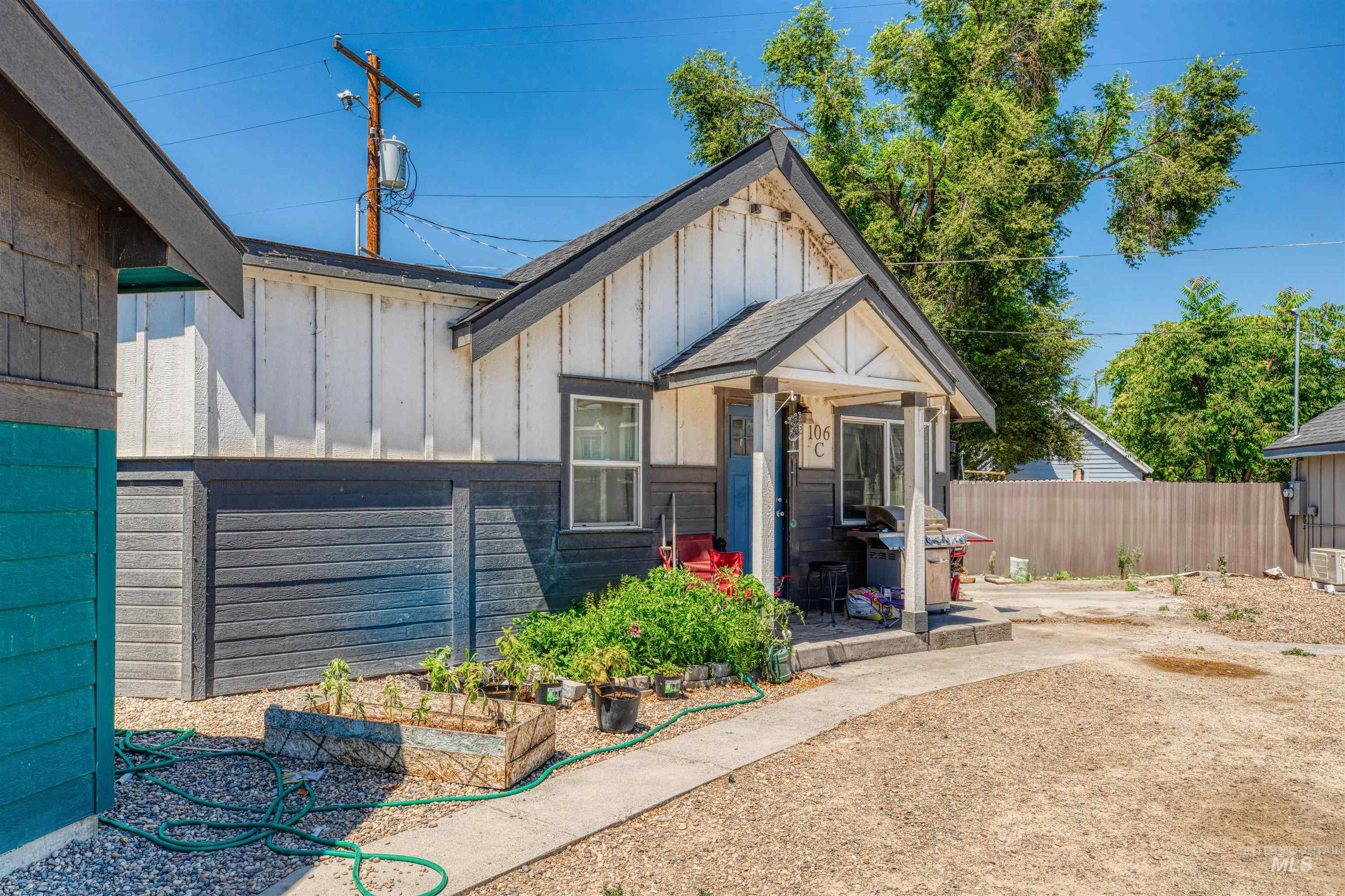 106 East Main Street Nyssa, OR 97913 - Photo 21 of 32 View of front of home with board and batten siding and a vegetable garden