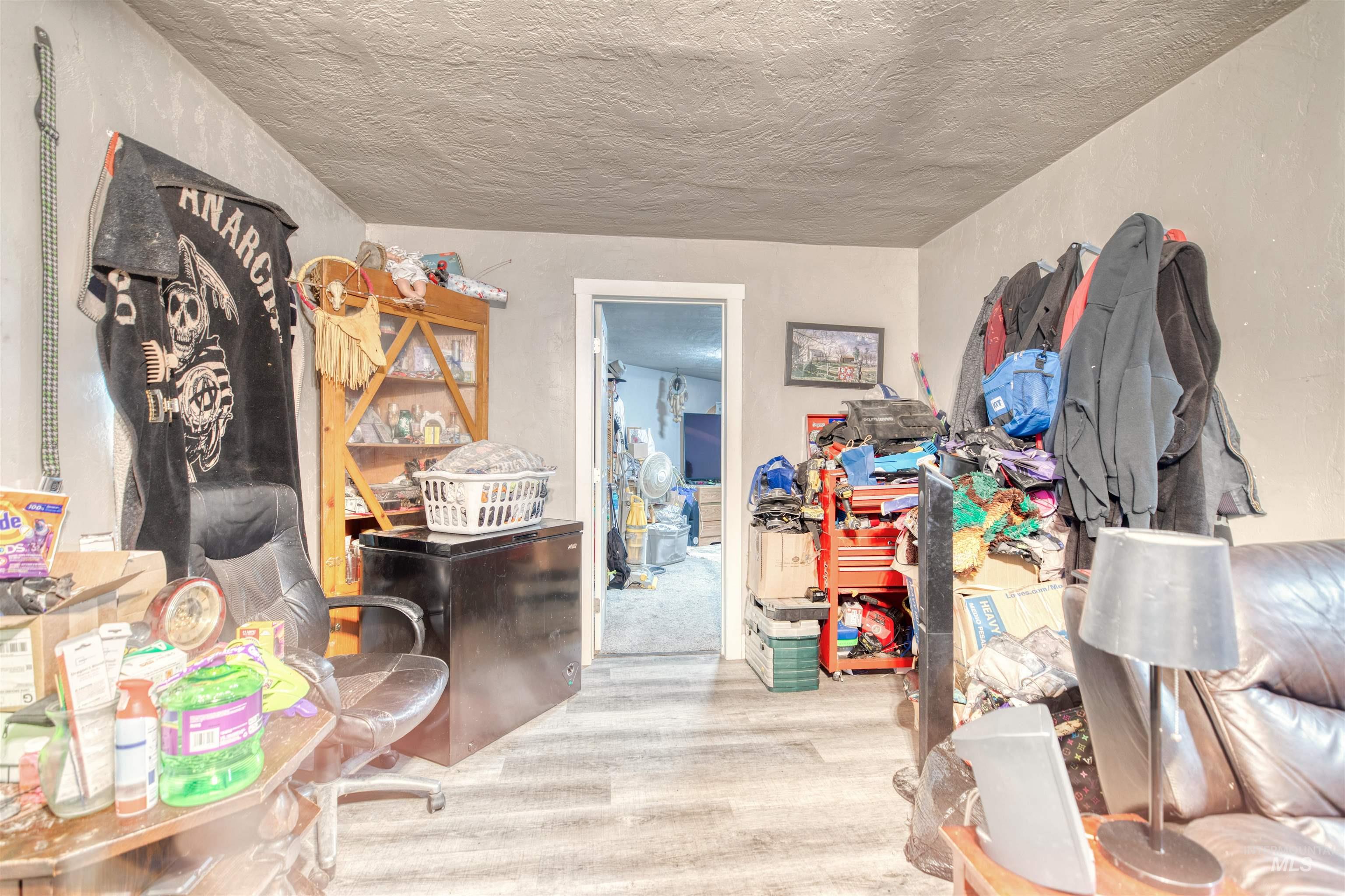 106 East Main Street Nyssa, OR 97913 - Photo 30 of 32 Interior space with wood finished floors and a textured ceiling