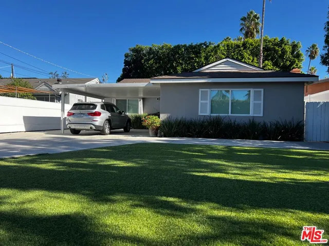 a car parked in front of a house